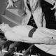 Yarto Yowa the fakir causes his assistant to lie on a bed of swords in Rome, circa 1950.